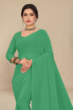 georgette weightless mint green saree with grain texture