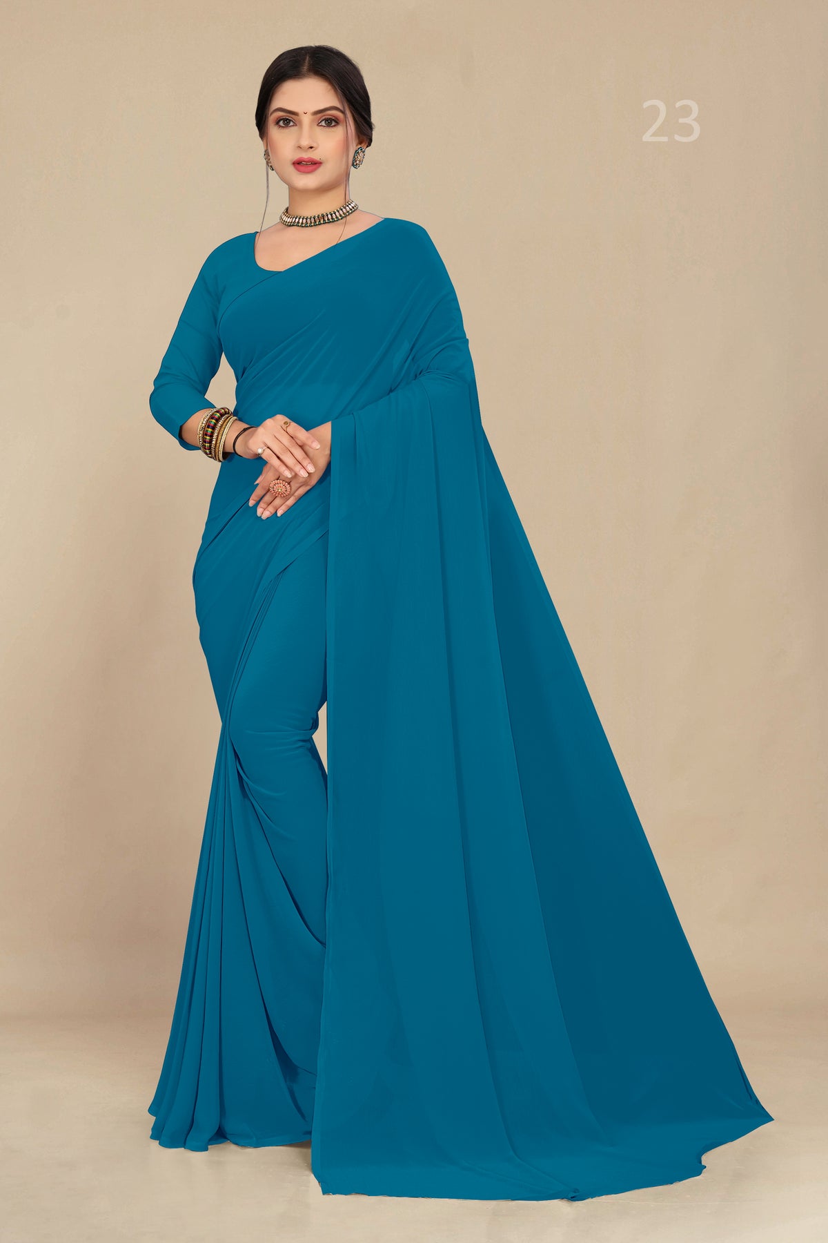 georgette weightless firozi saree with grain texture