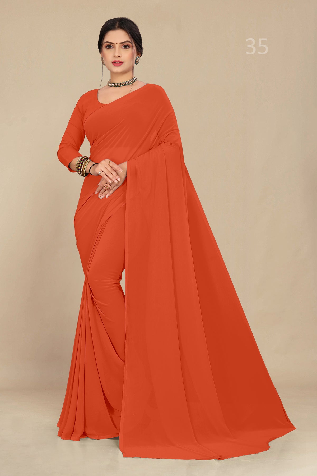 georgette weightless orange saree with grain texture