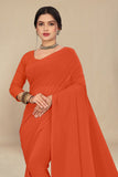 georgette weightless orange saree with grain texture