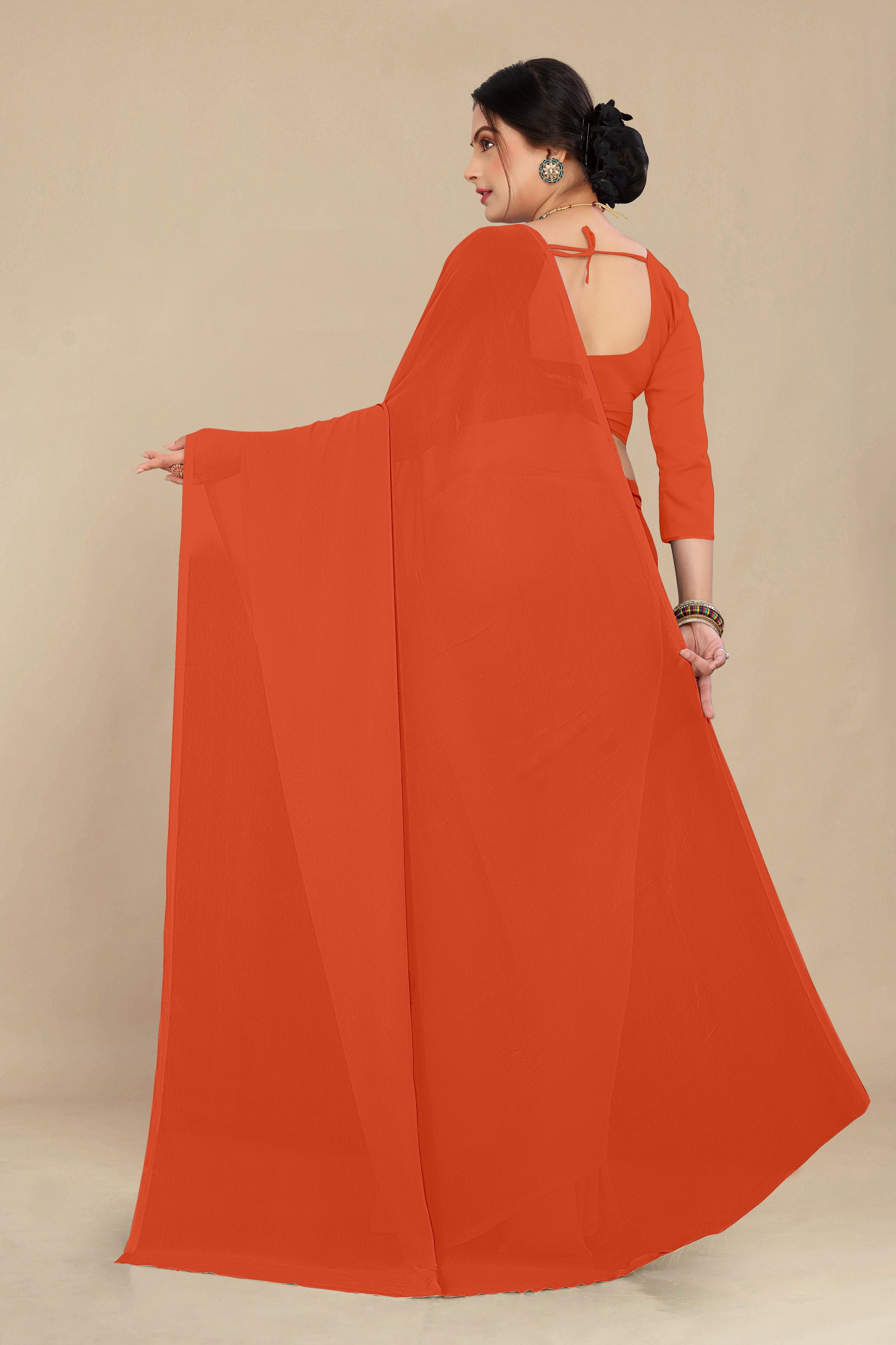 georgette weightless orange saree with grain texture