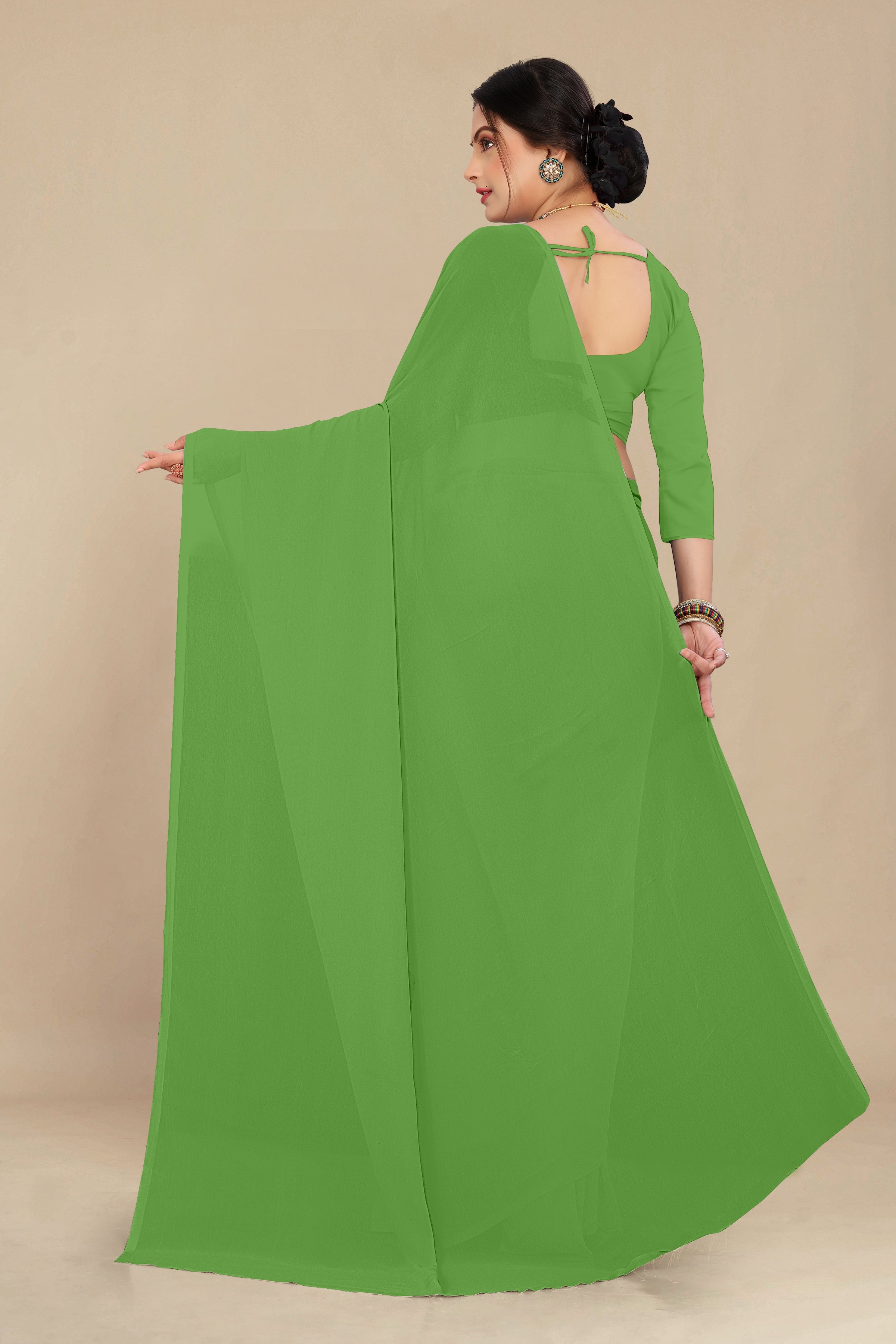 georgette weightless dull green saree with grain texture