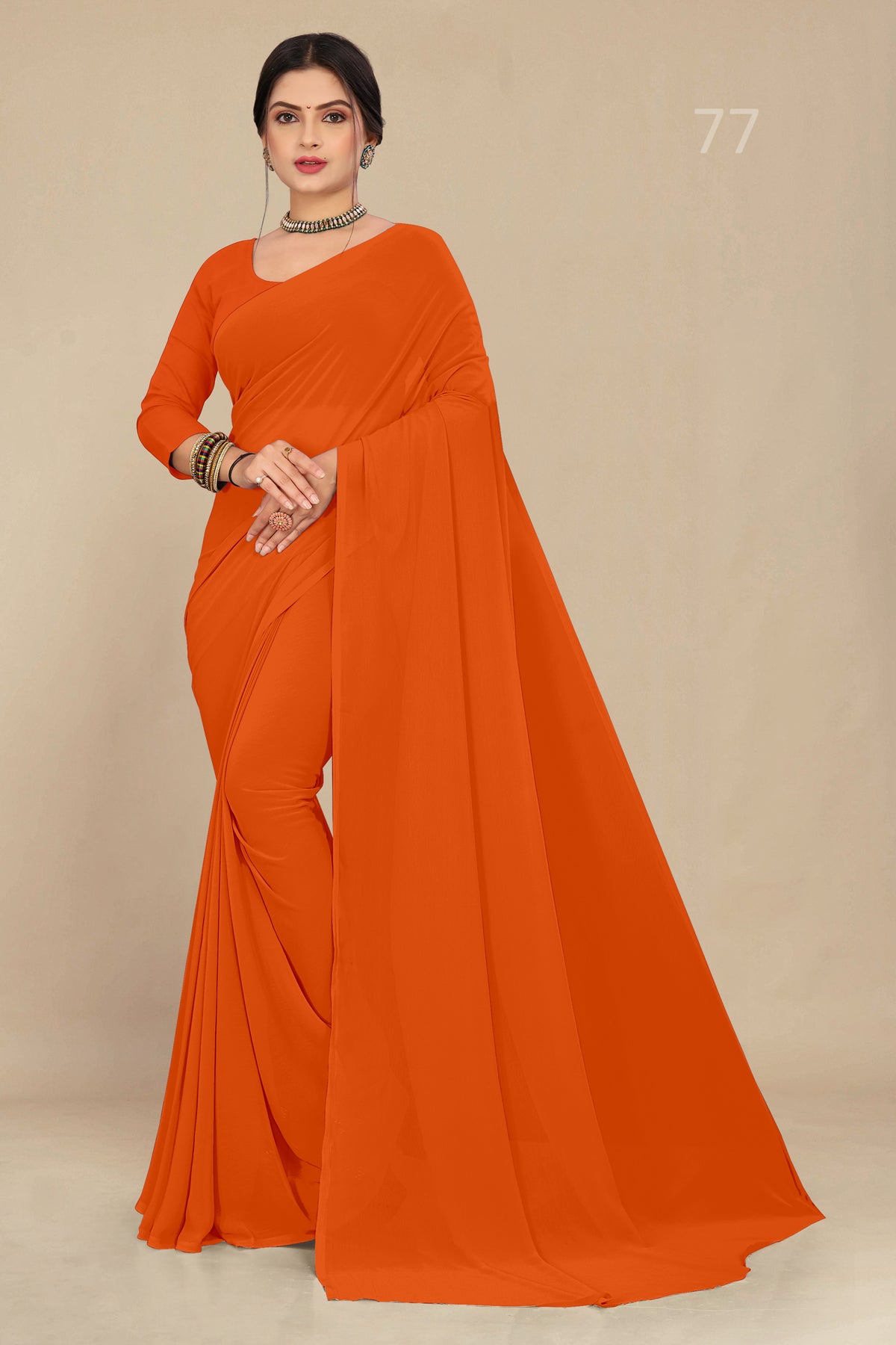 georgette weightless dark orange saree with grain texture